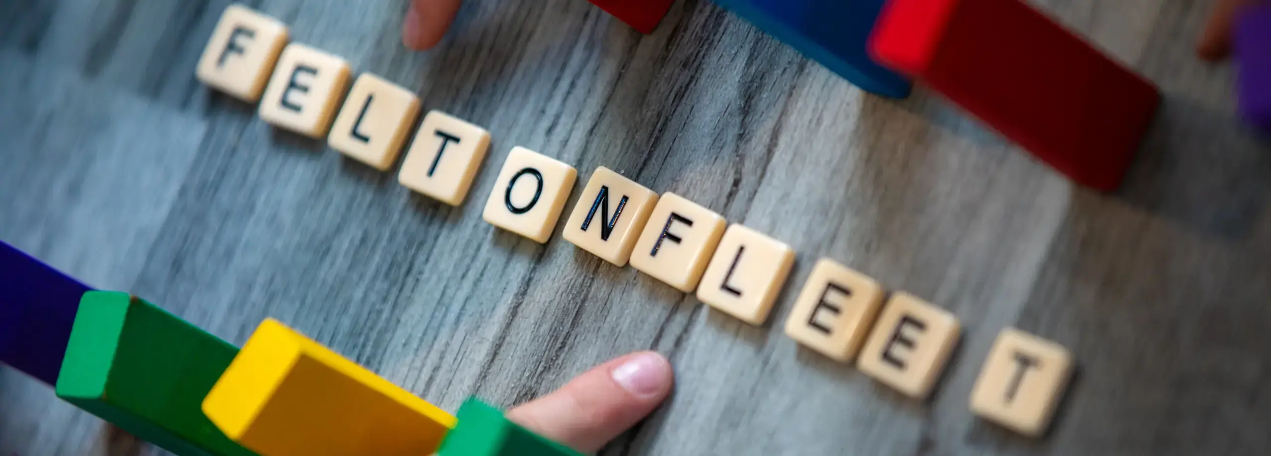 Feltonfleet written in scrabble letters with dominoes