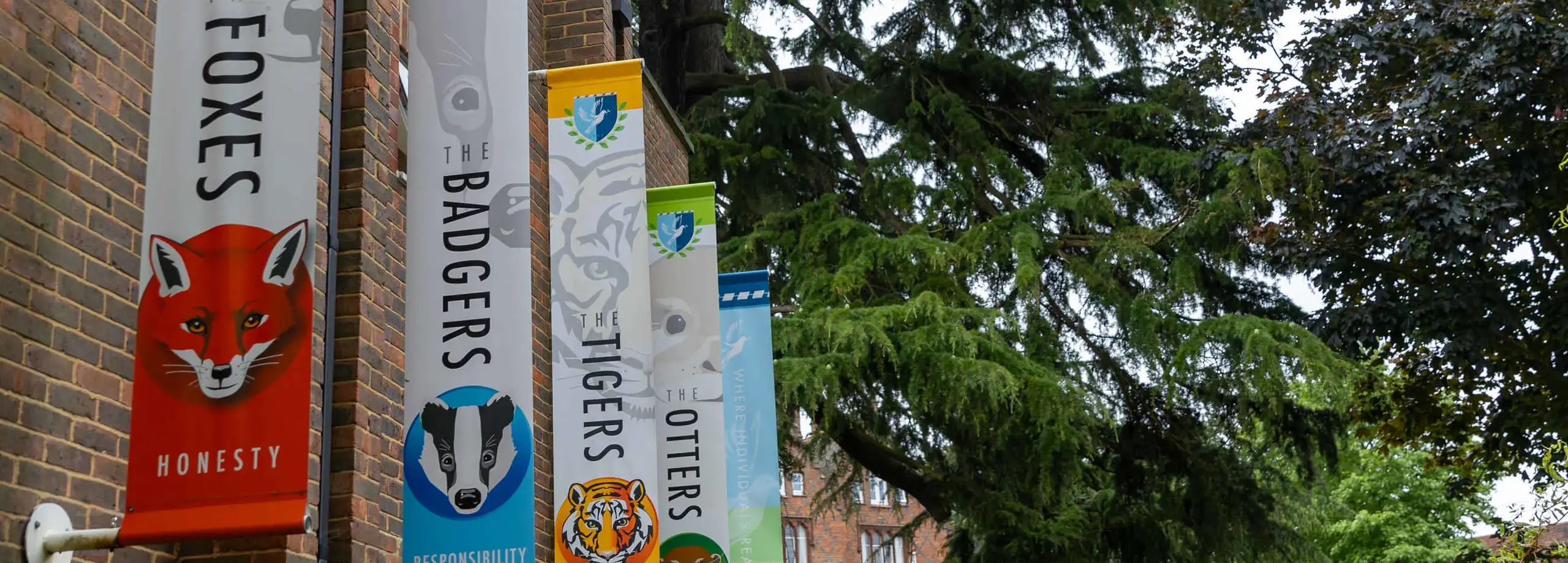 The Four Feltonfleet House banners hanging from a wall