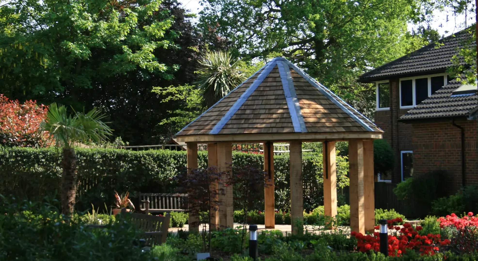 A bandstand surrounded by foliage