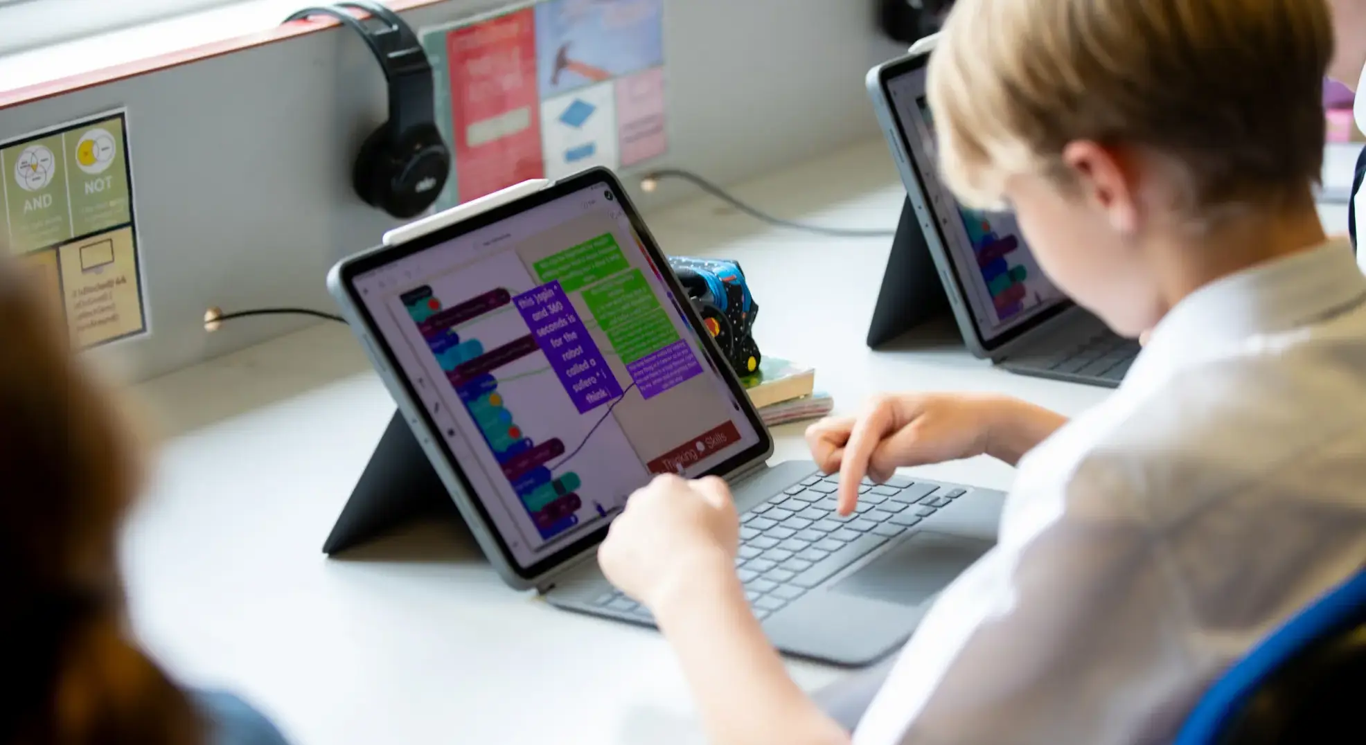 Student coding on an iPad