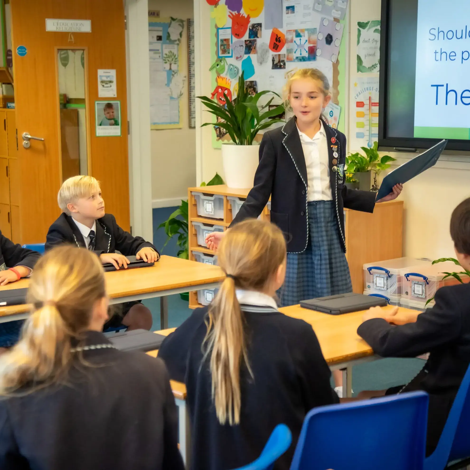 Student giving presentation in debate lesson