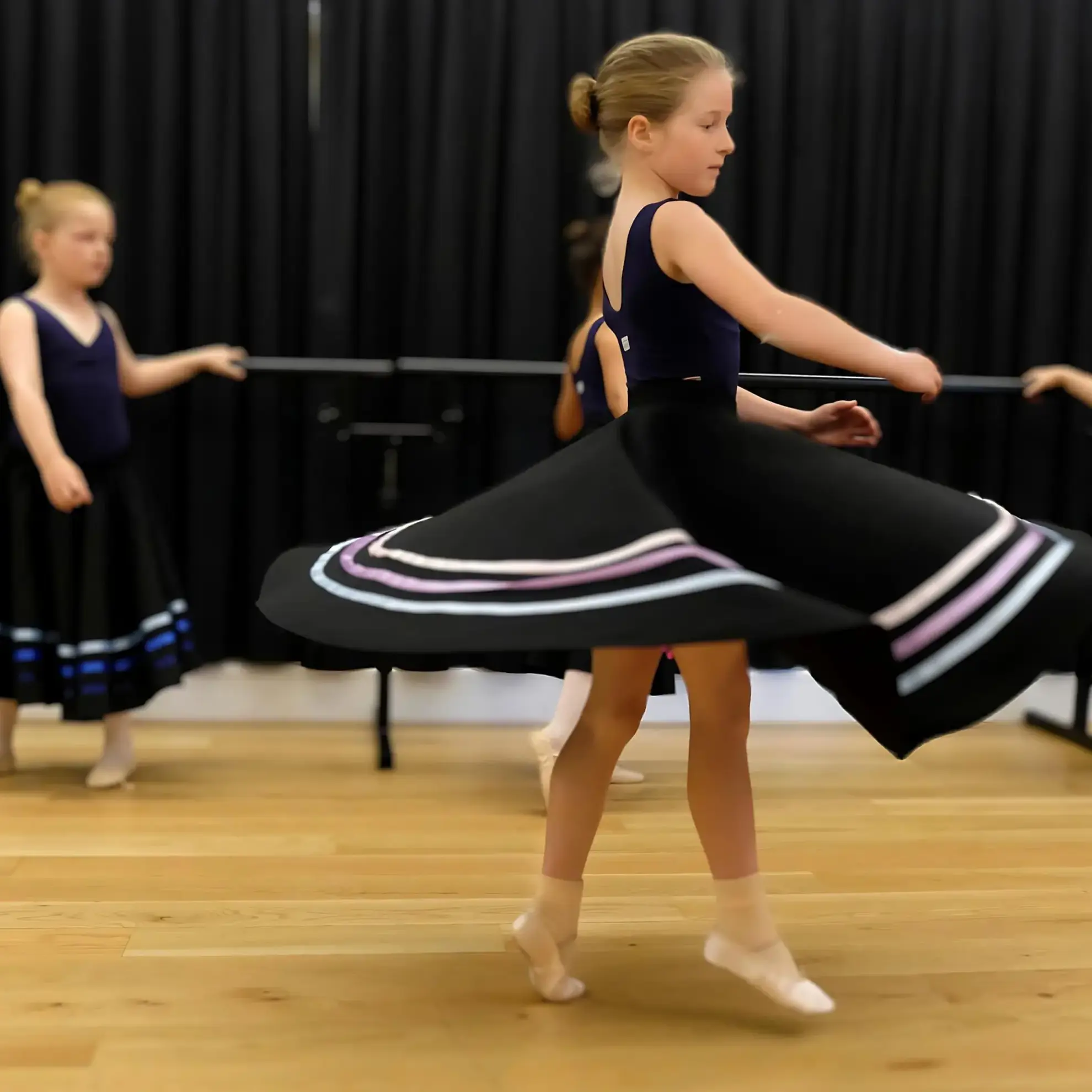 Student in dance club twirling