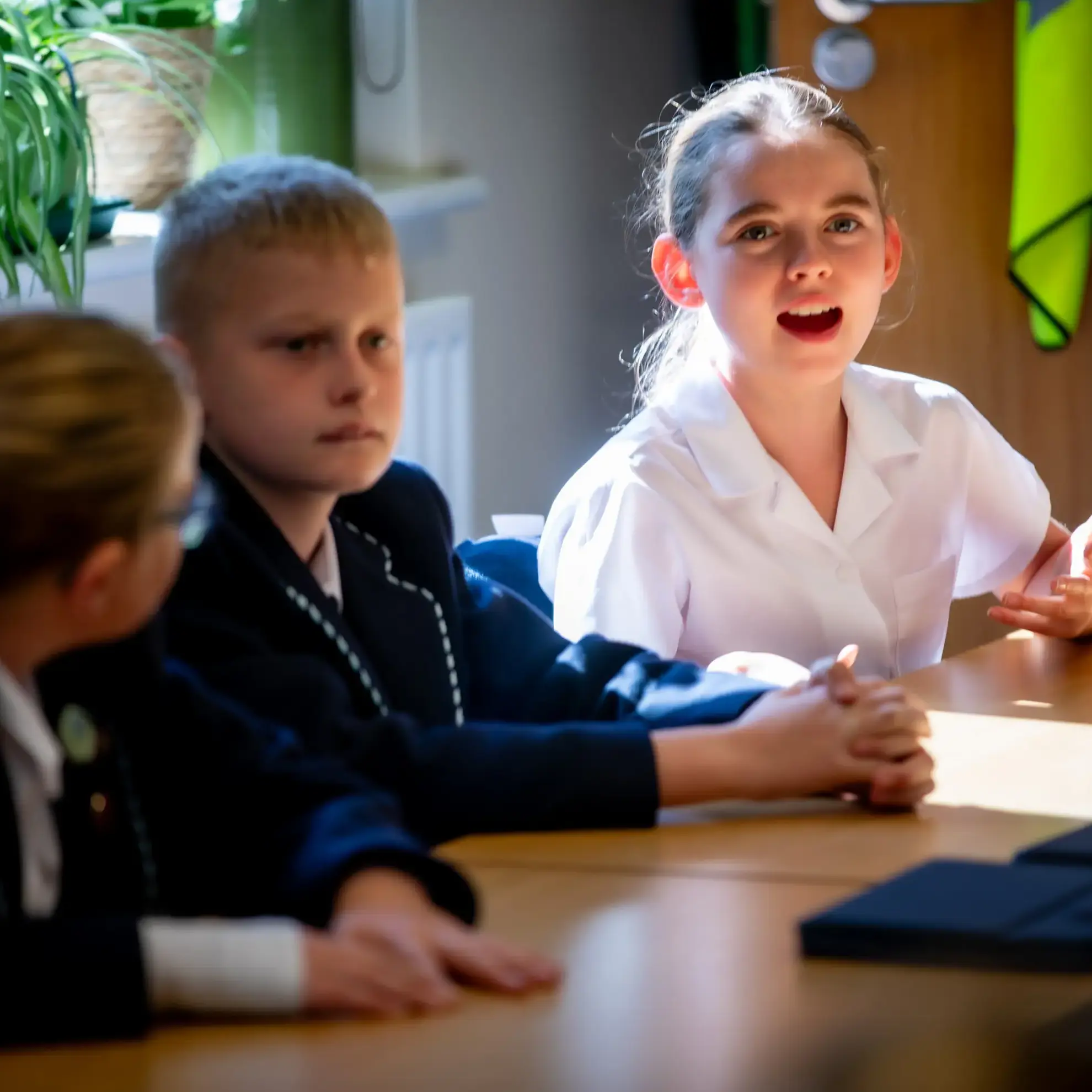 Students engaging in debate lesson