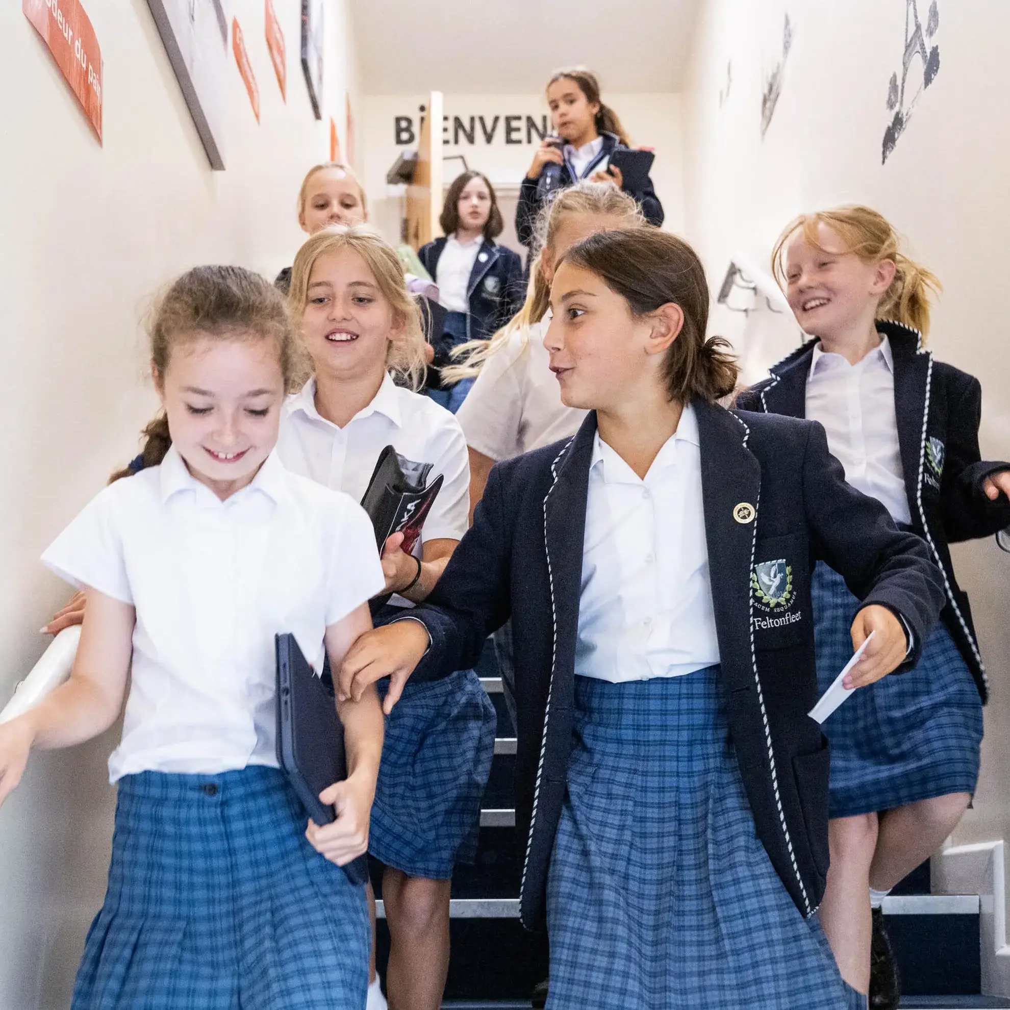 Students walking down stairs