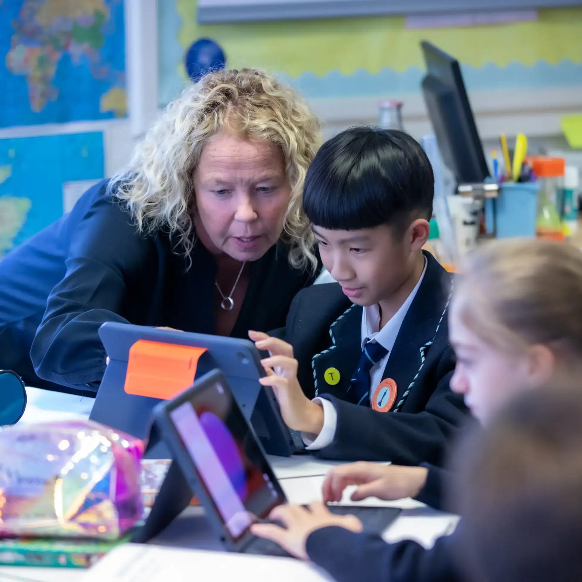 Student and teacher working together on iPad
