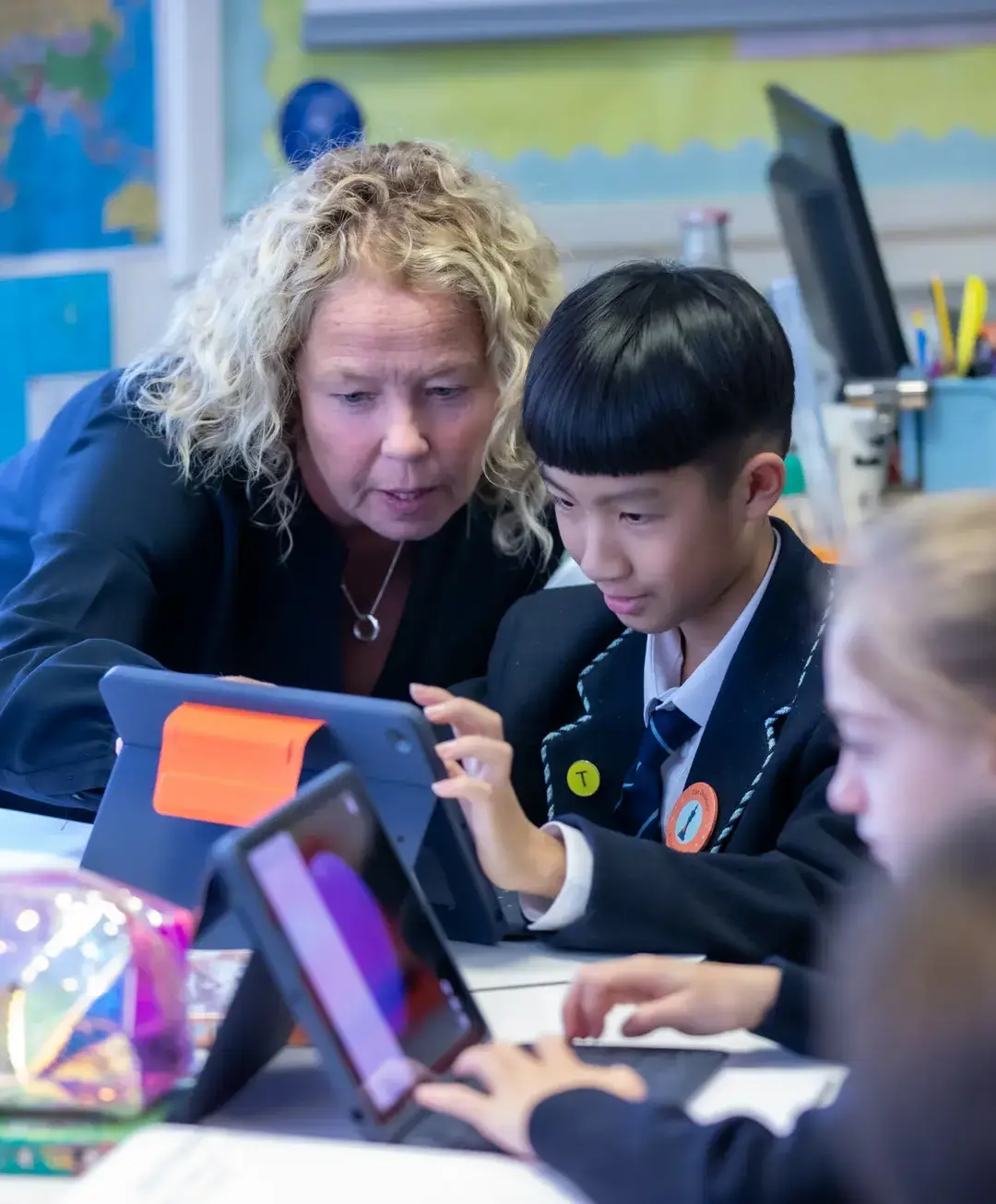 Teacher and student looking at iPad