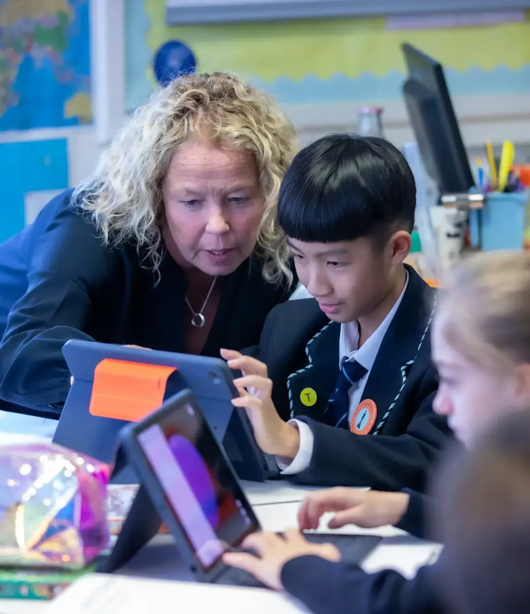 Teacher and student looking at iPad