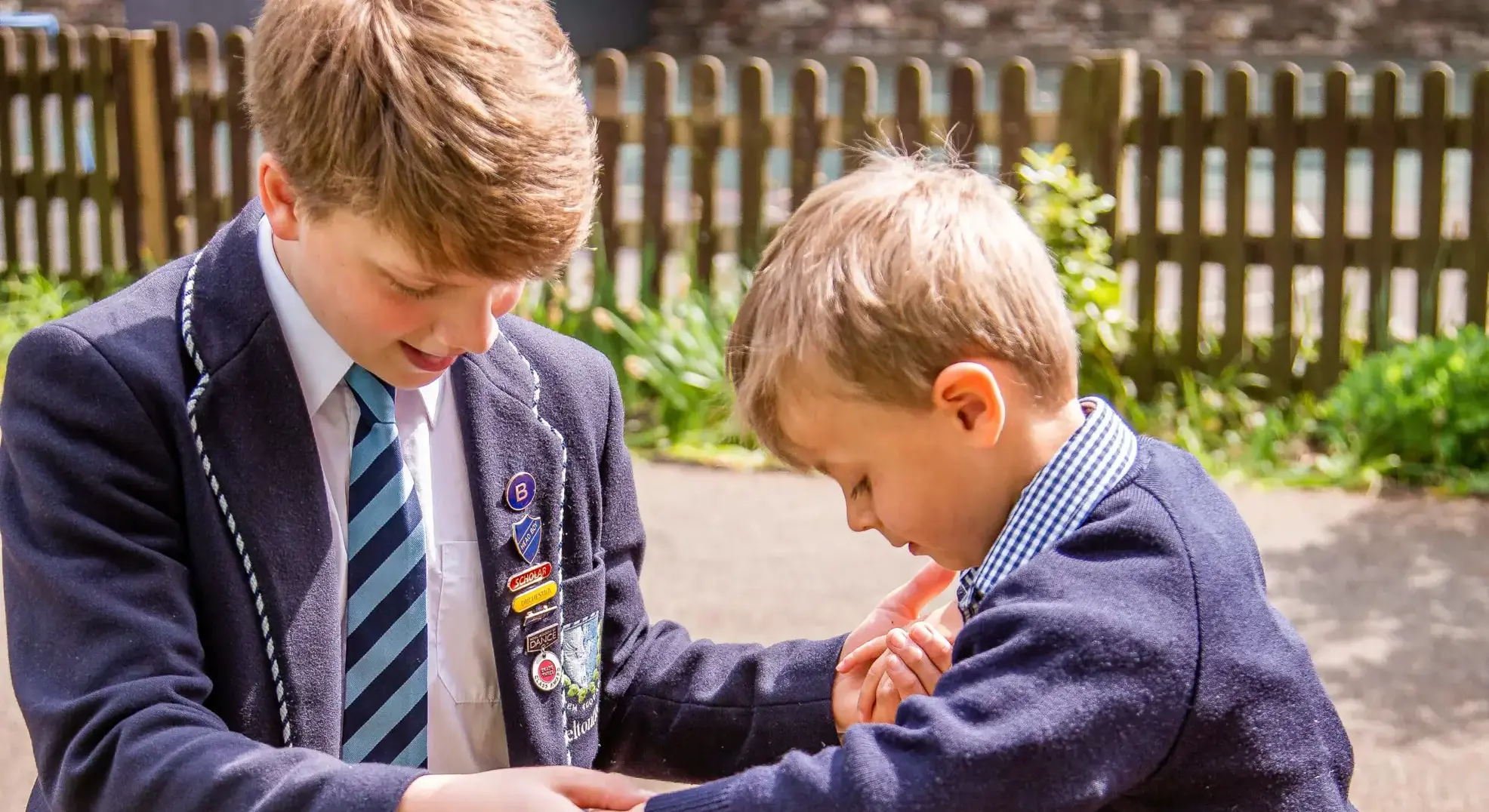 Mixed Age Pupils Supporting Each Other Feltonfleet Private School SurreySingle Image
