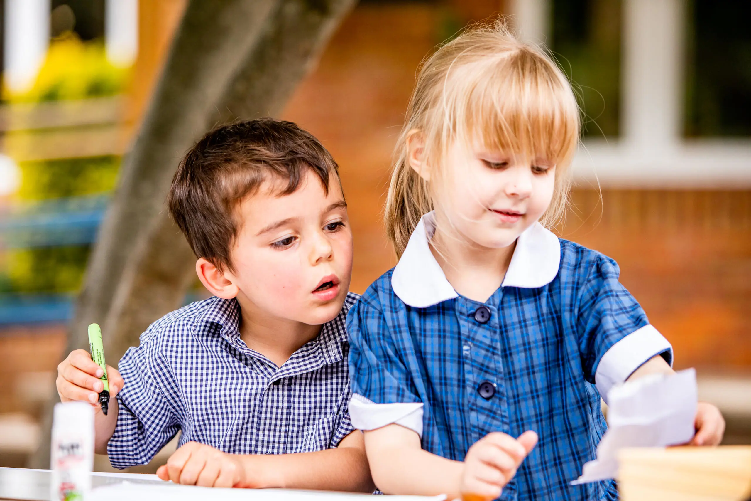 Two students reading a piece of paper