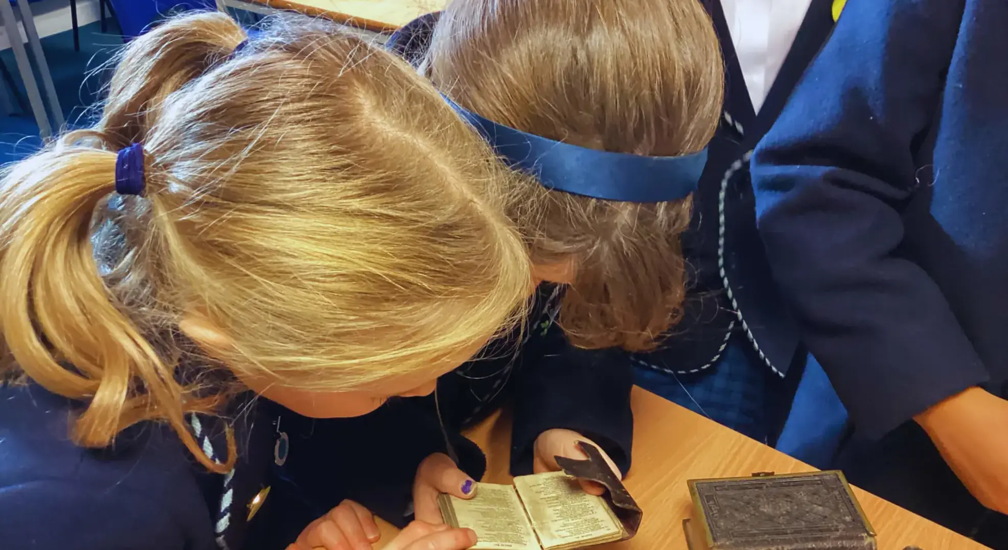 Pupils studying Historical religious books EDI Feltonfleet Private School Surrey