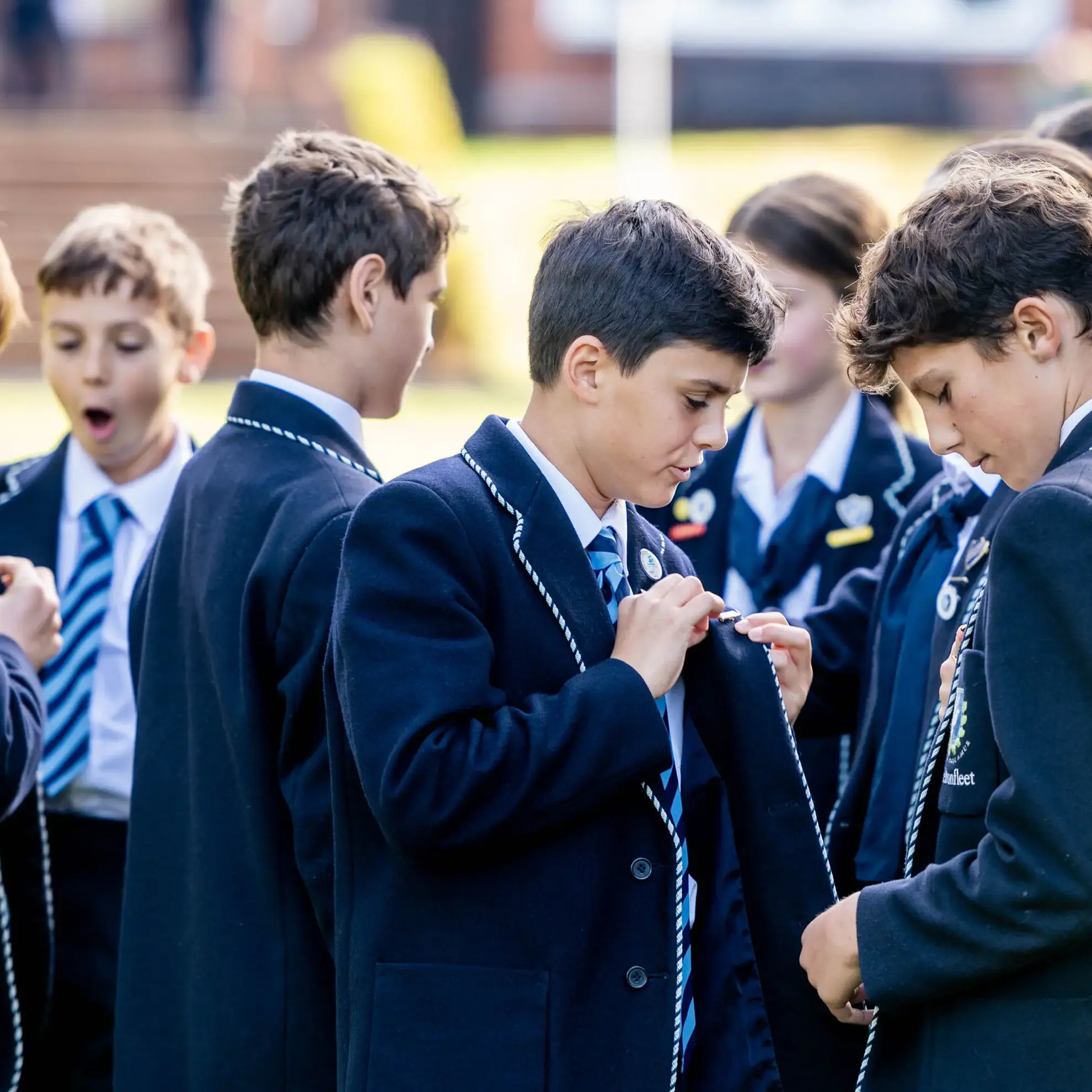 Students comparing leadership badges