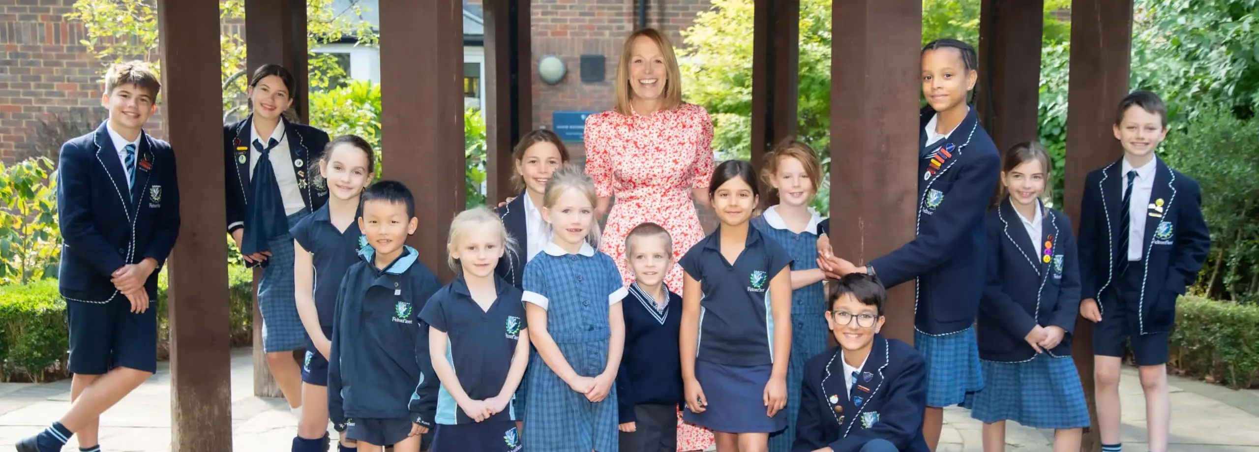 Headmistress Shelley Lance with mixed age pupils Feltonfleet private school surrey