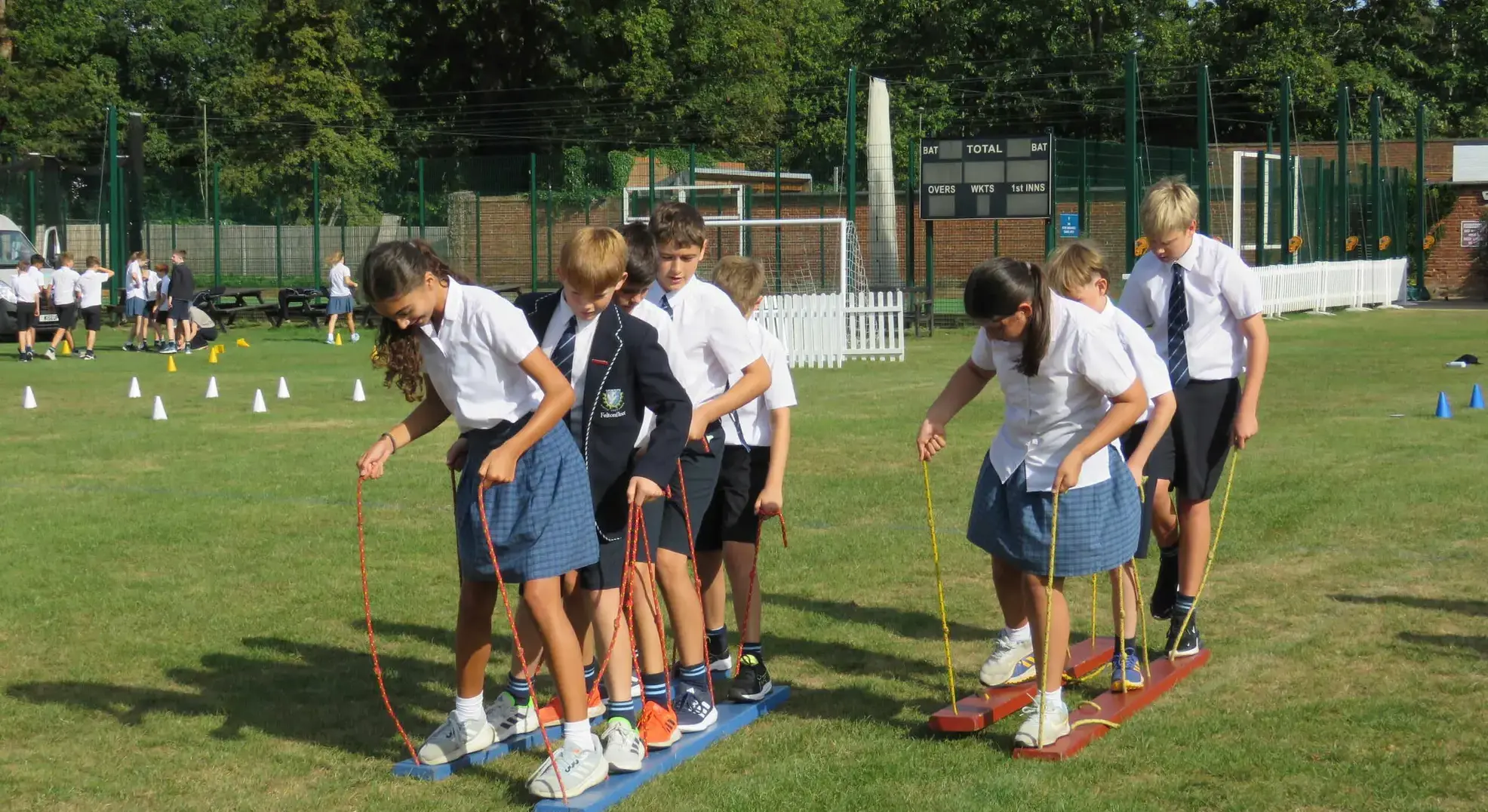 Students taking part in a plank-walking race