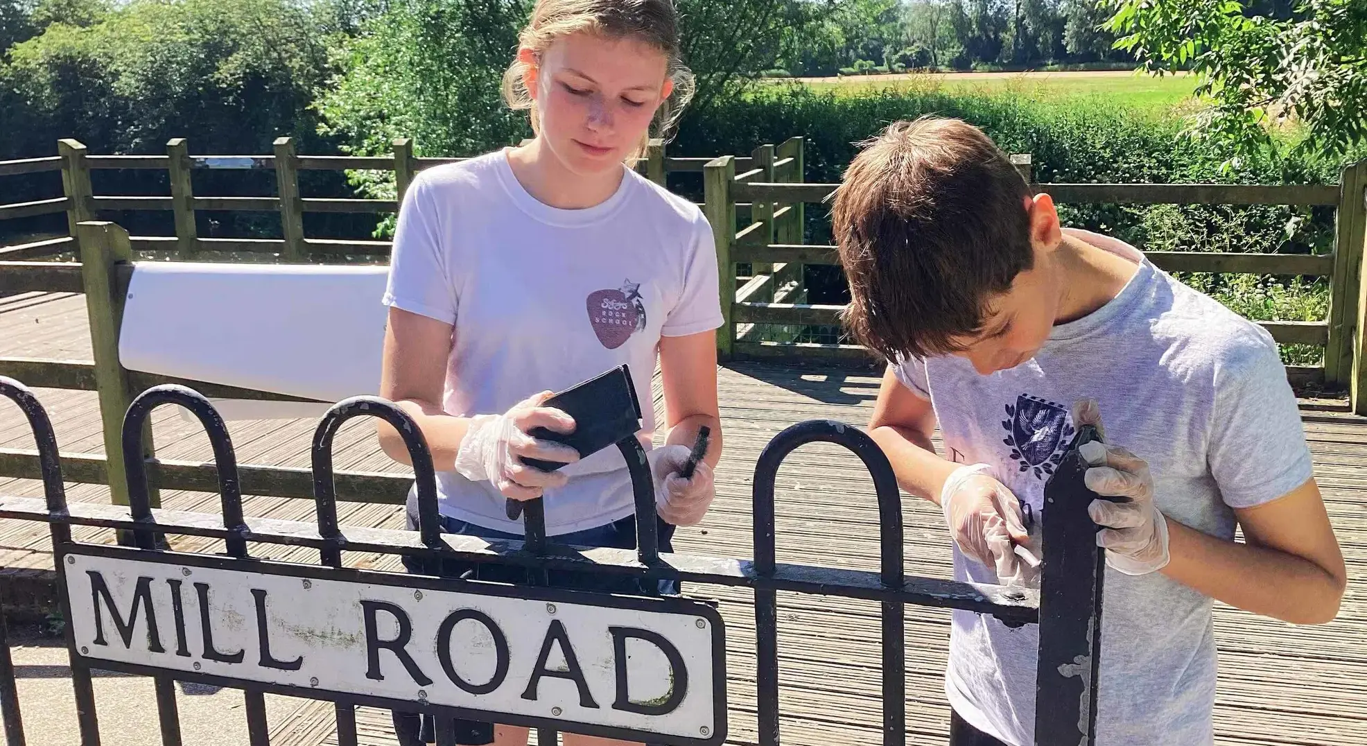 Students repairing gate