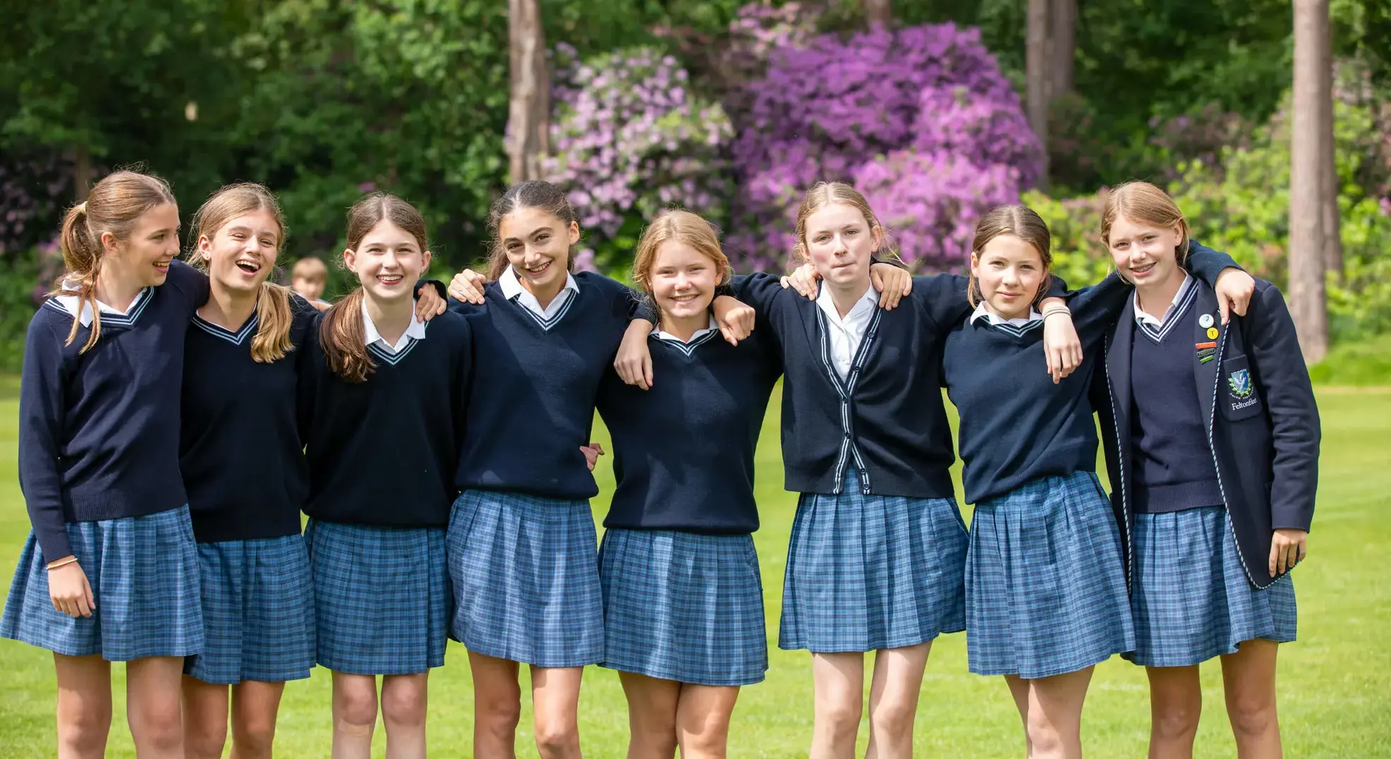 Group of students standing together on a field