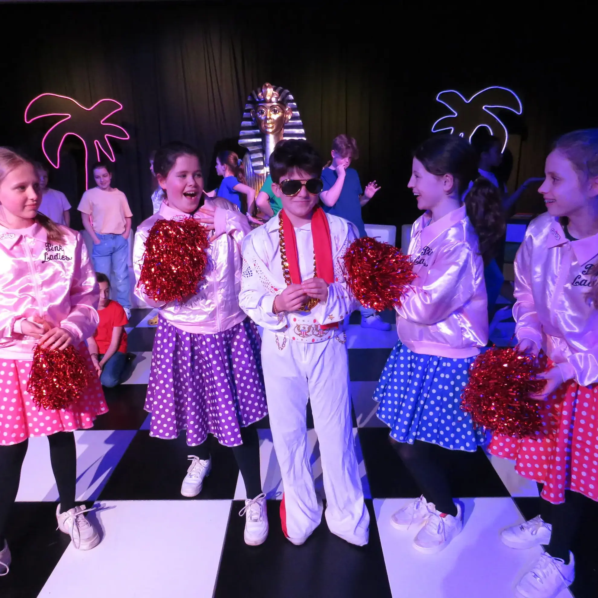 Students on stage in drama production