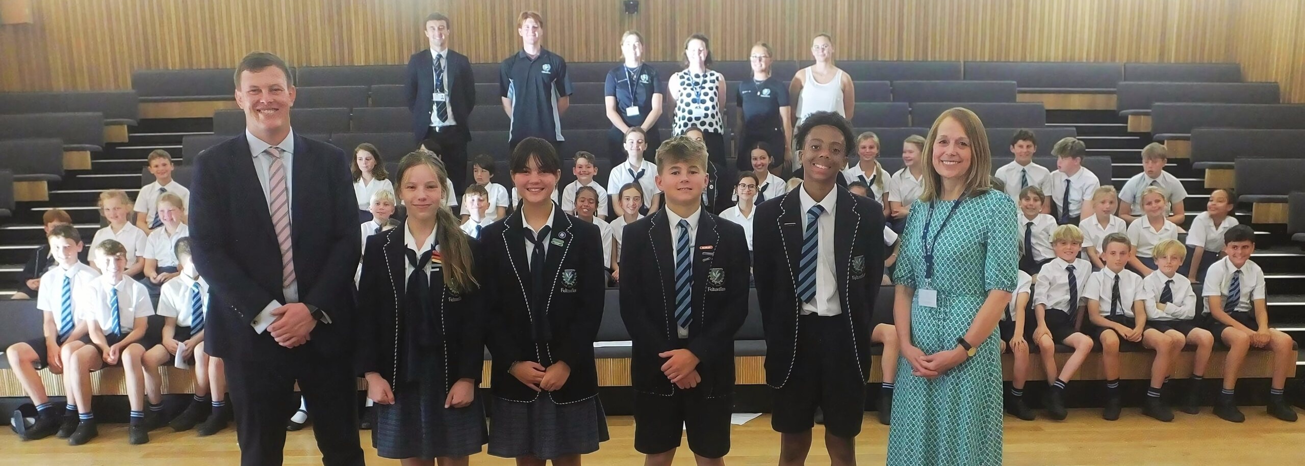 Fletonfleet Knights posing with teachers and ceremonial setup