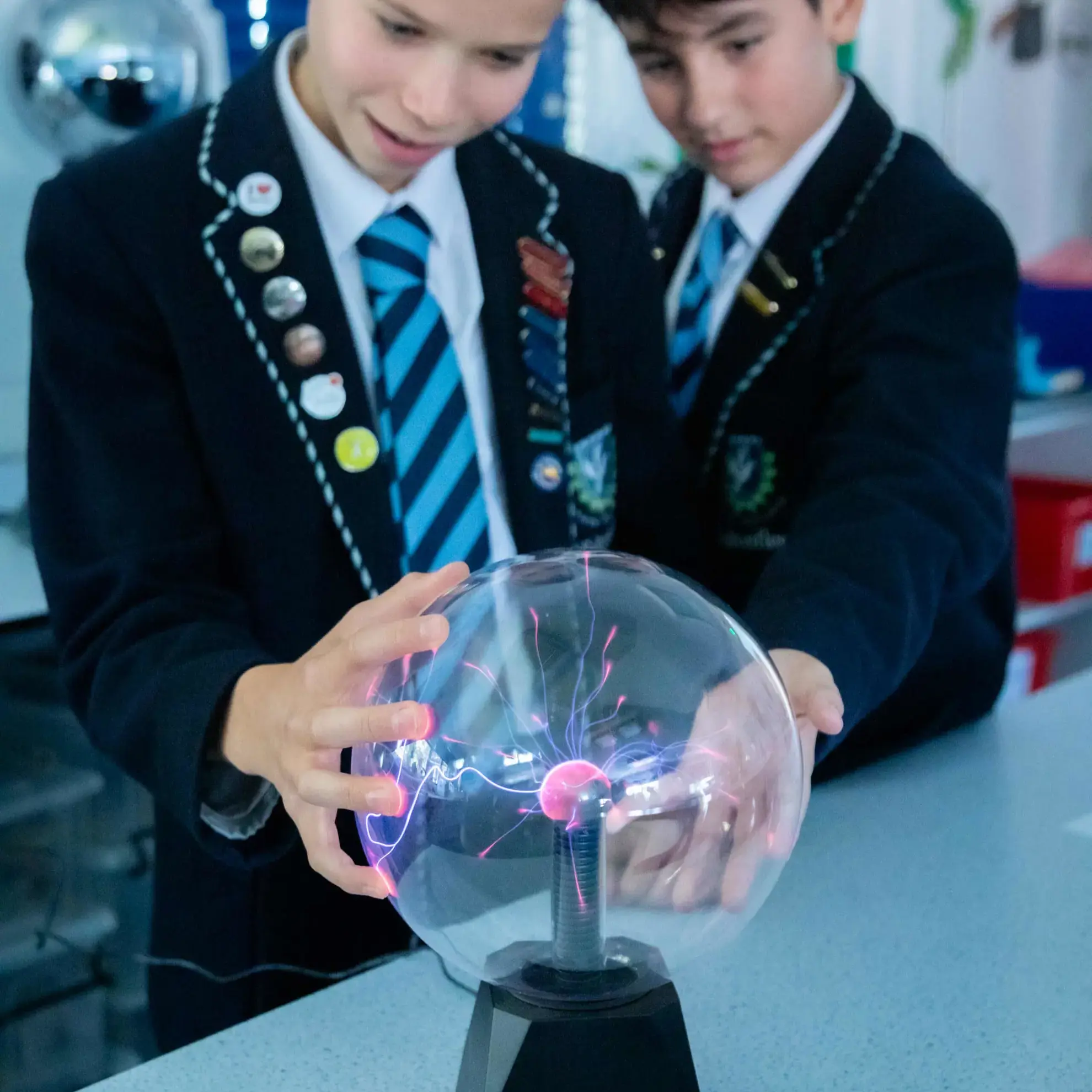 Students experimenting with plasma lamp