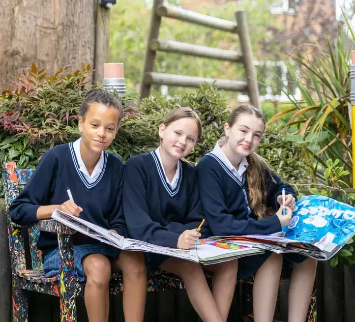 Upper school girls sketching outside art studio Feltonfleet Private School Surrey