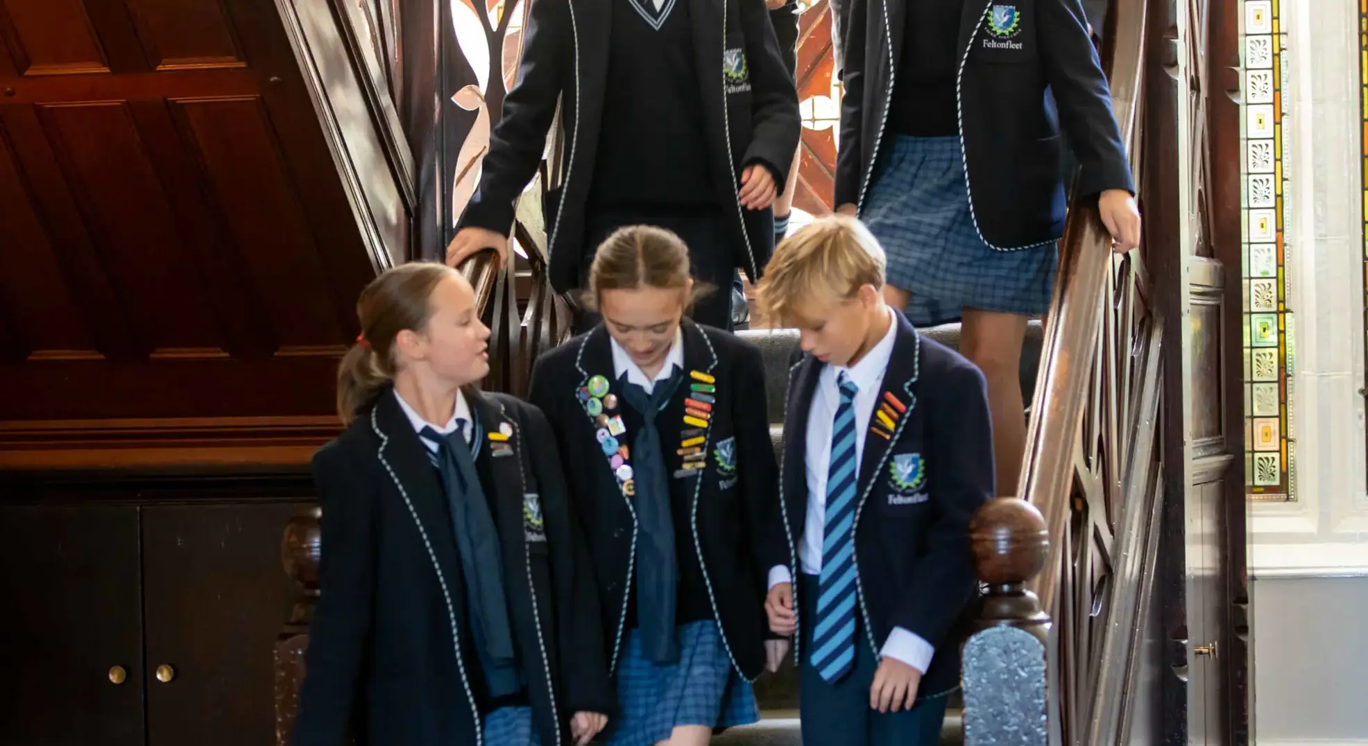 Students walking down stairs