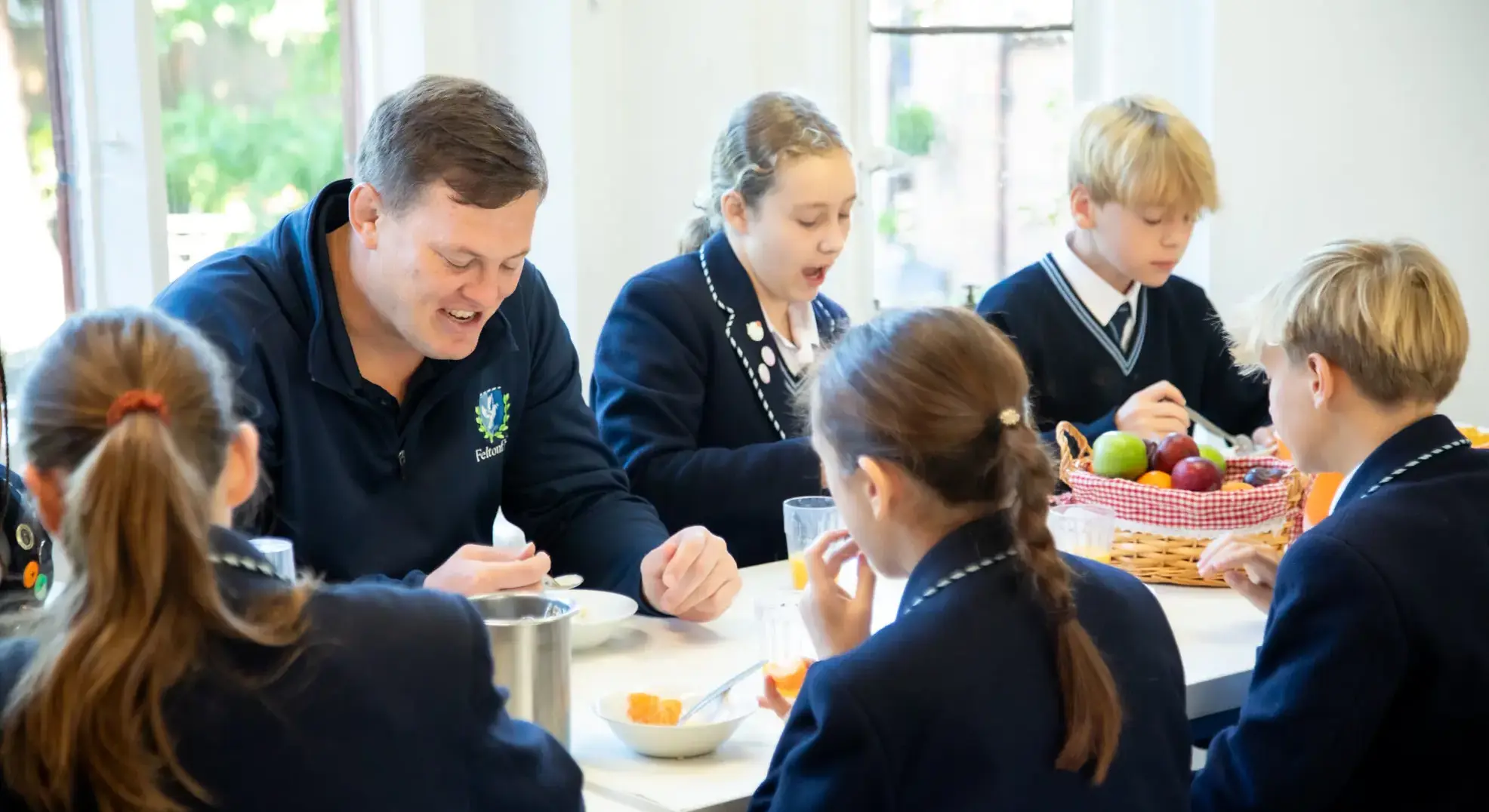 Head of Boarding eating breakfast with students