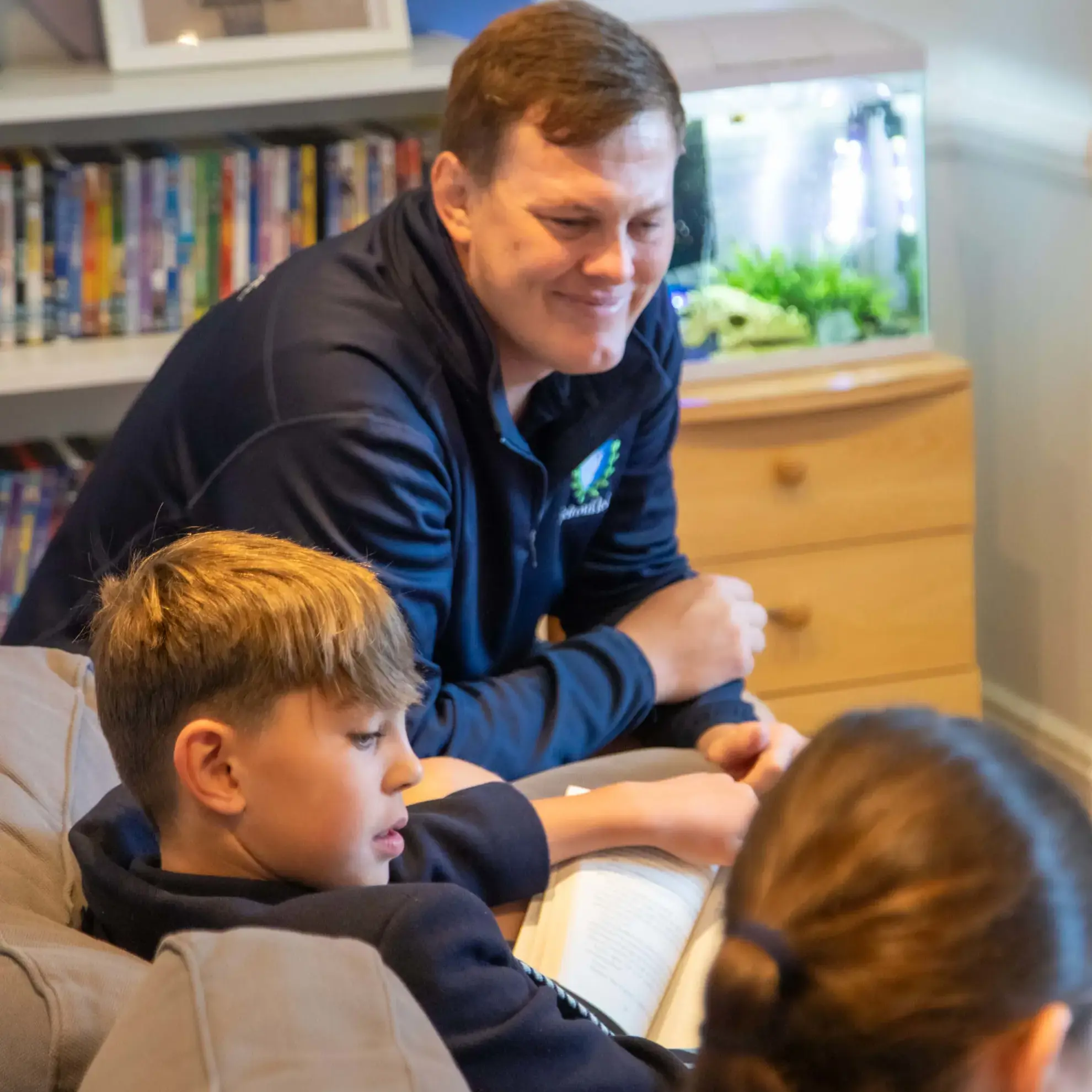 Head of Boarding sitting with students