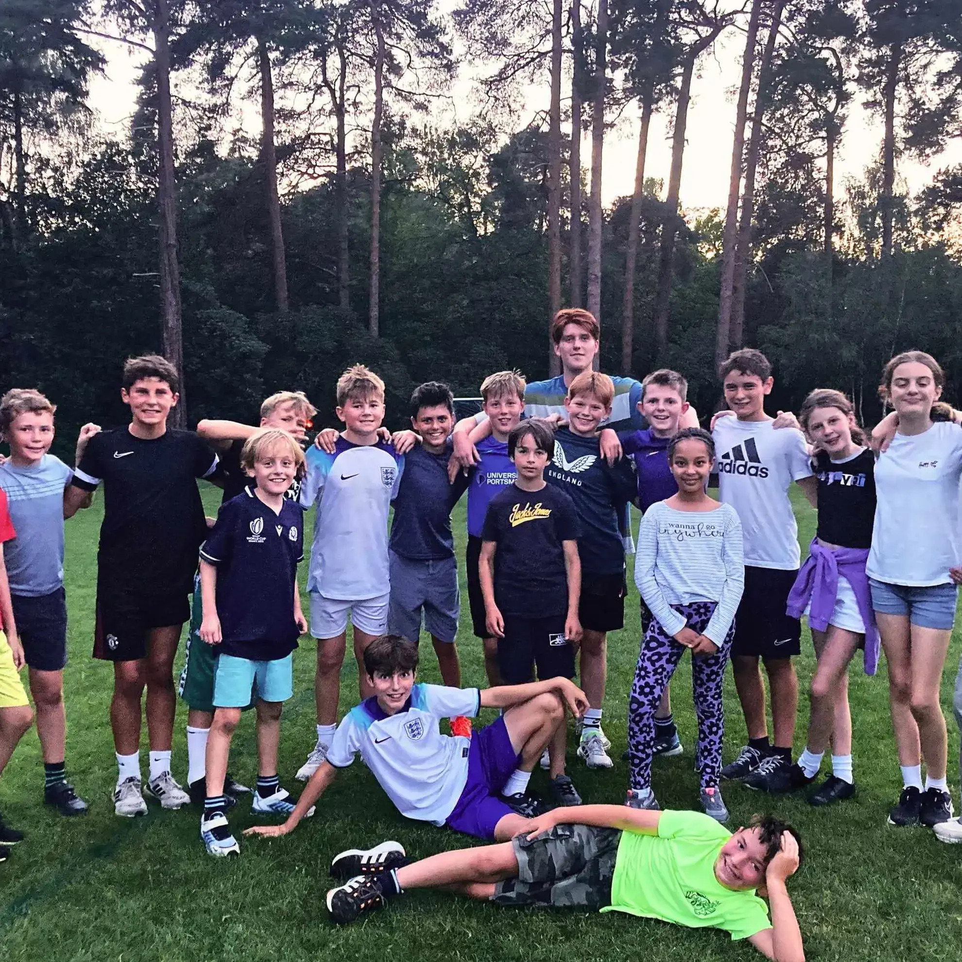 Football players posing on a field
