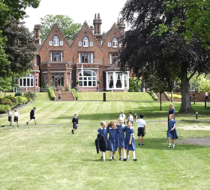 Pupils on Feltonfleet lawn at main house Private School SurreyAcademic Excellence Gallery Left